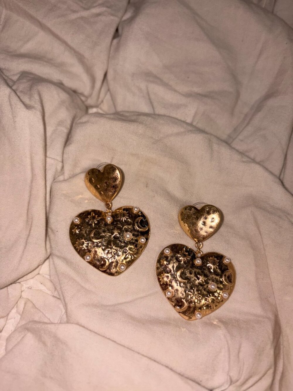 Elevate your accessory game with this charming, cream-colored floral statement r